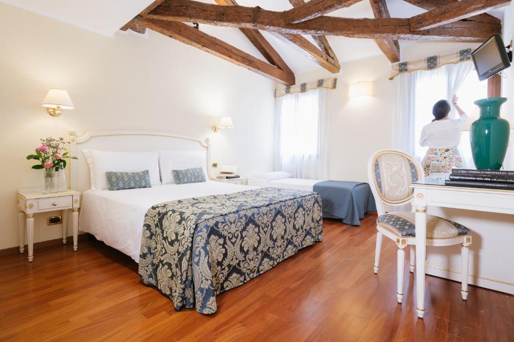Llit o llits en una habitació de Hotel Do Pozzi