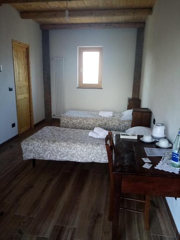 Postel nebo postele na pokoji v ubytování Cascina Bucolica B&B
