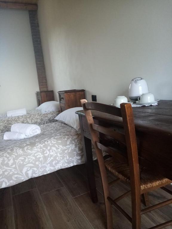 Postel nebo postele na pokoji v ubytování Cascina Bucolica B&B