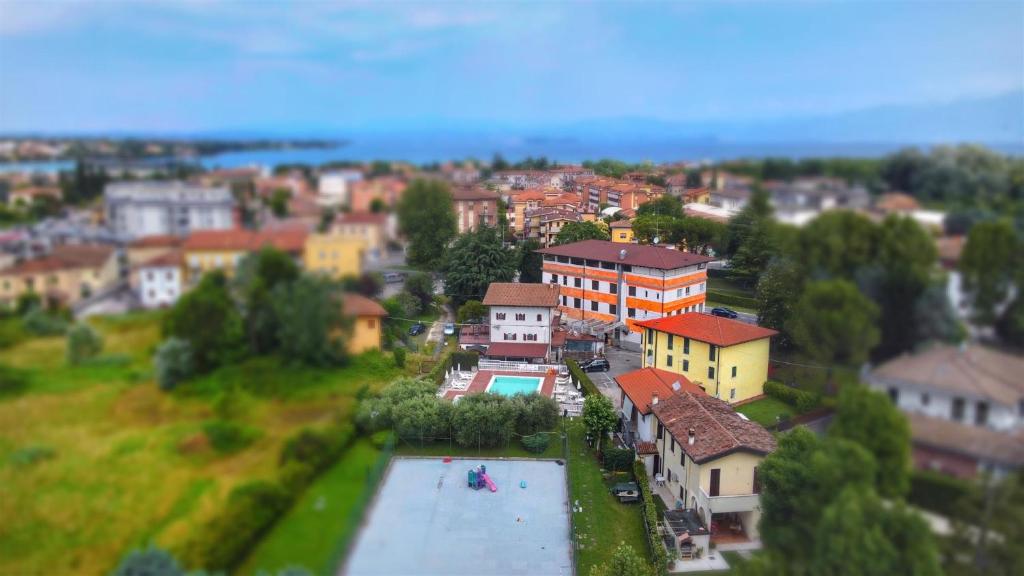 a view of a town with a river in a city at Hotel Bel Sito in Peschiera del Garda