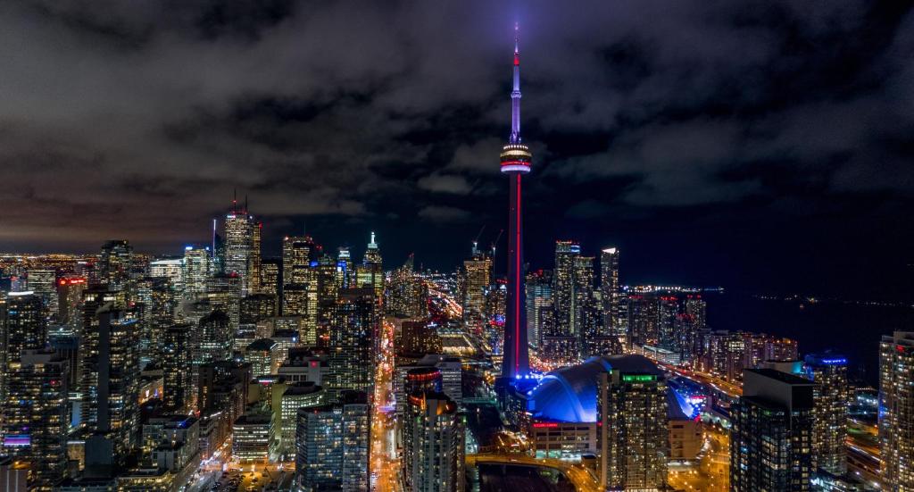 a view of the cn tower at night at Holiday Inn Toronto Downtown Centre by IHG in Toronto
