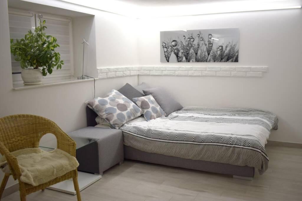 Posteľ alebo postele v izbe v ubytovaní Przytulny apartamentt