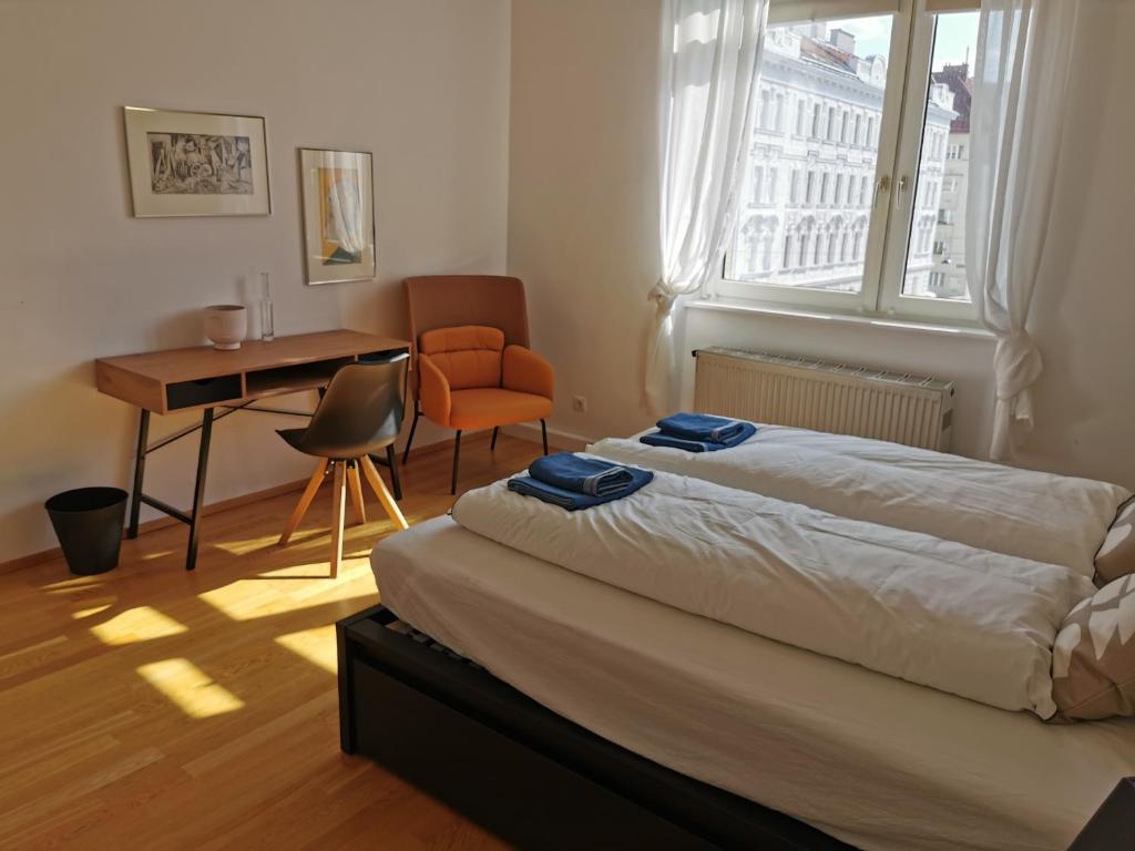 En eller flere senge i et værelse på Vienna Experience