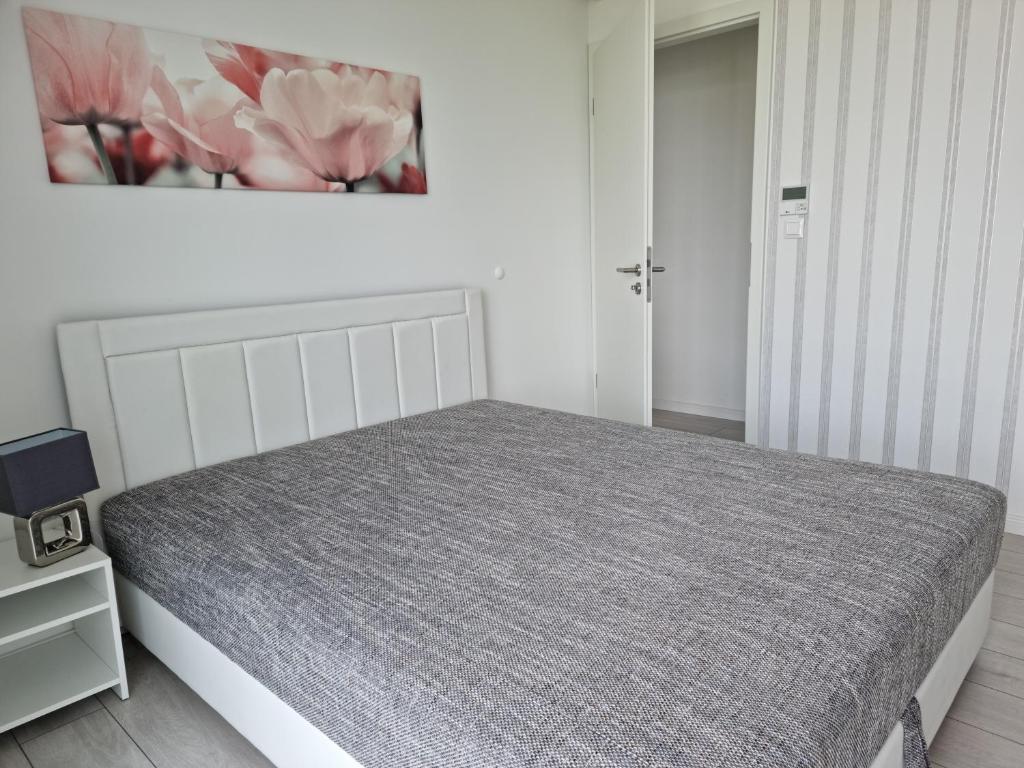 Łóżko lub łóżka w pokoju w obiekcie Best Panoráma Apartman