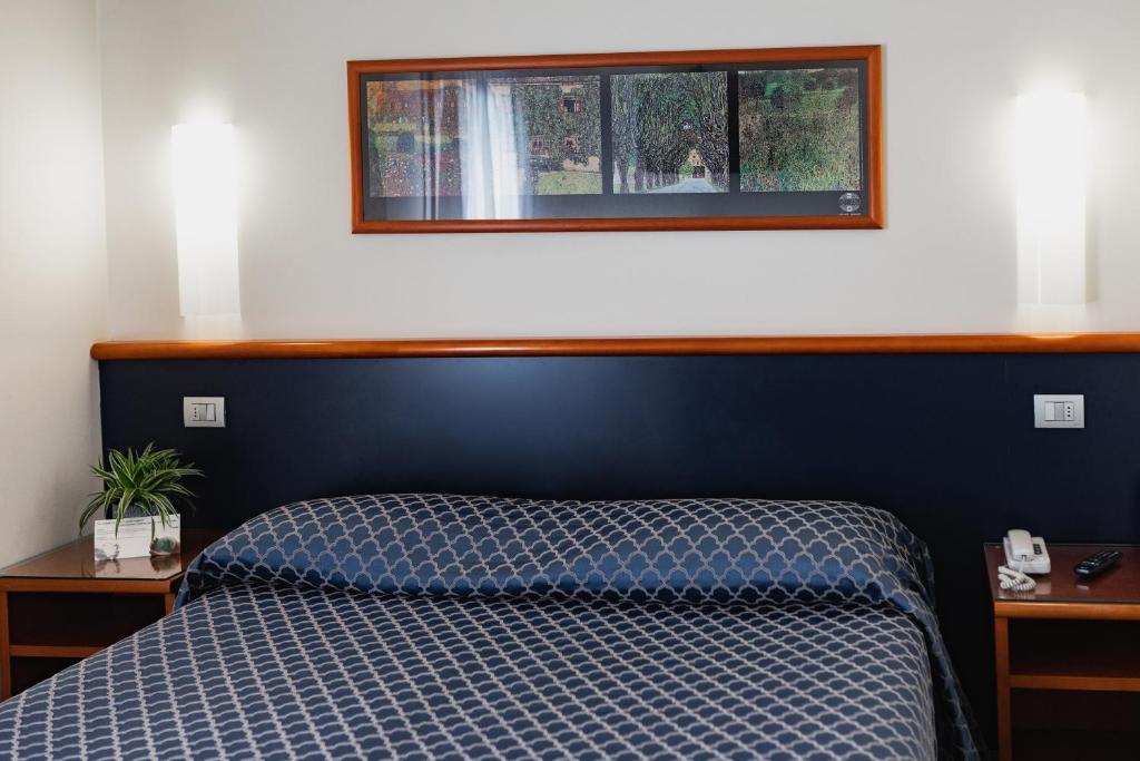 Posteľ alebo postele v izbe v ubytovaní Hotel Crystal