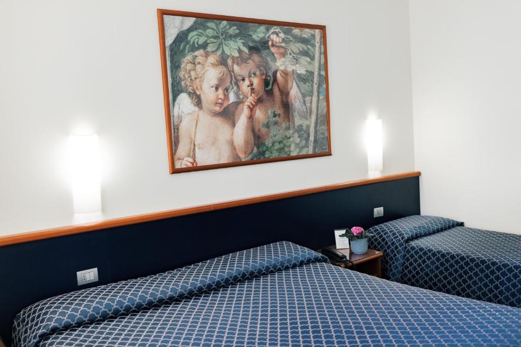 Posteľ alebo postele v izbe v ubytovaní Hotel Crystal