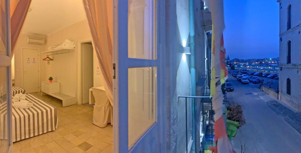 Łóżko lub łóżka w pokoju w obiekcie Nuova Mastrarua Rooms