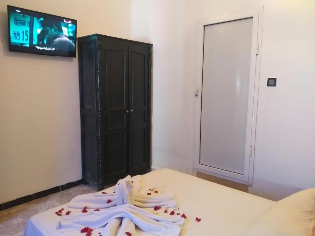 Postel nebo postele na pokoji v ubytování Hôtel Agnaou