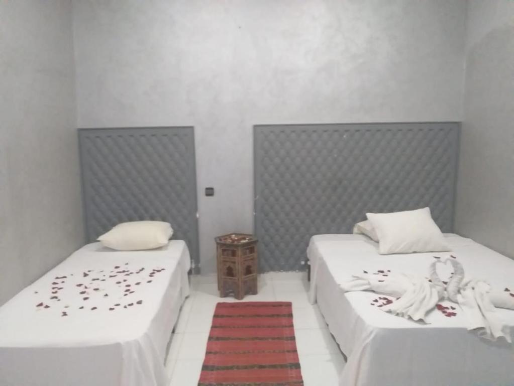 Postel nebo postele na pokoji v ubytování Hôtel Agnaou