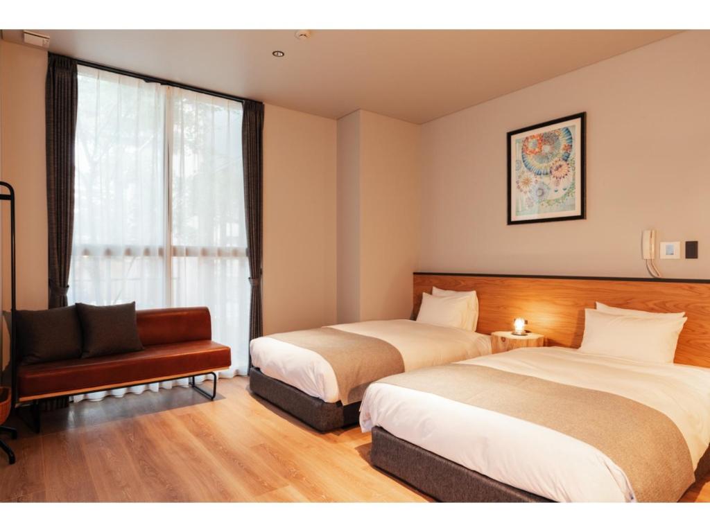 Llit o llits en una habitació de HOTEL KARUIZAWA CROSS - Vacation STAY 56456v