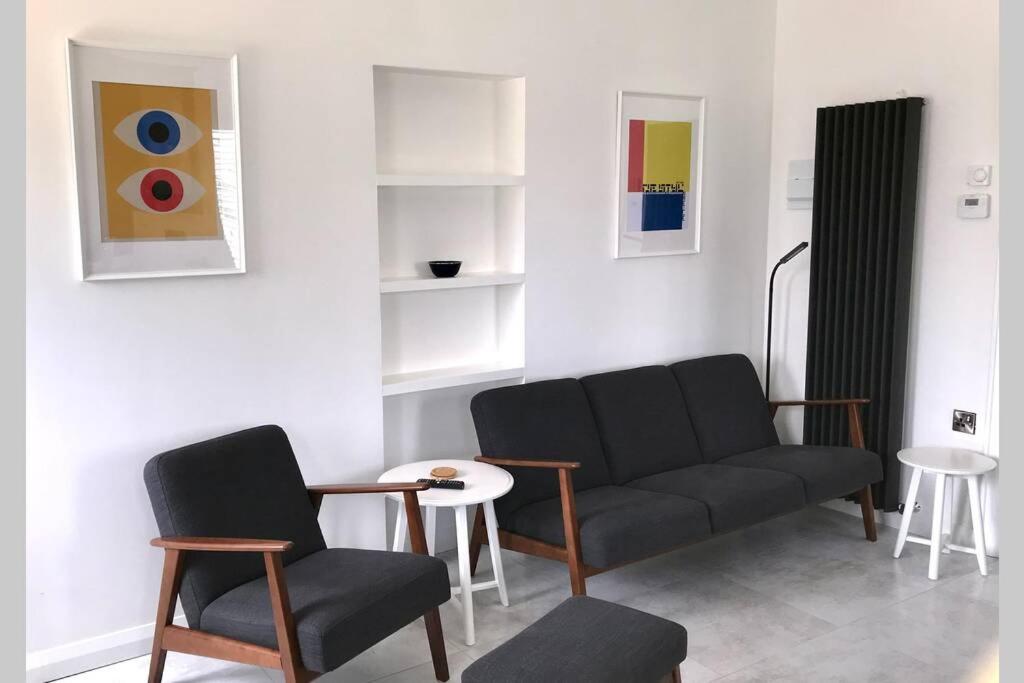 a living room with a couch and two chairs at Sperrin View in Omagh