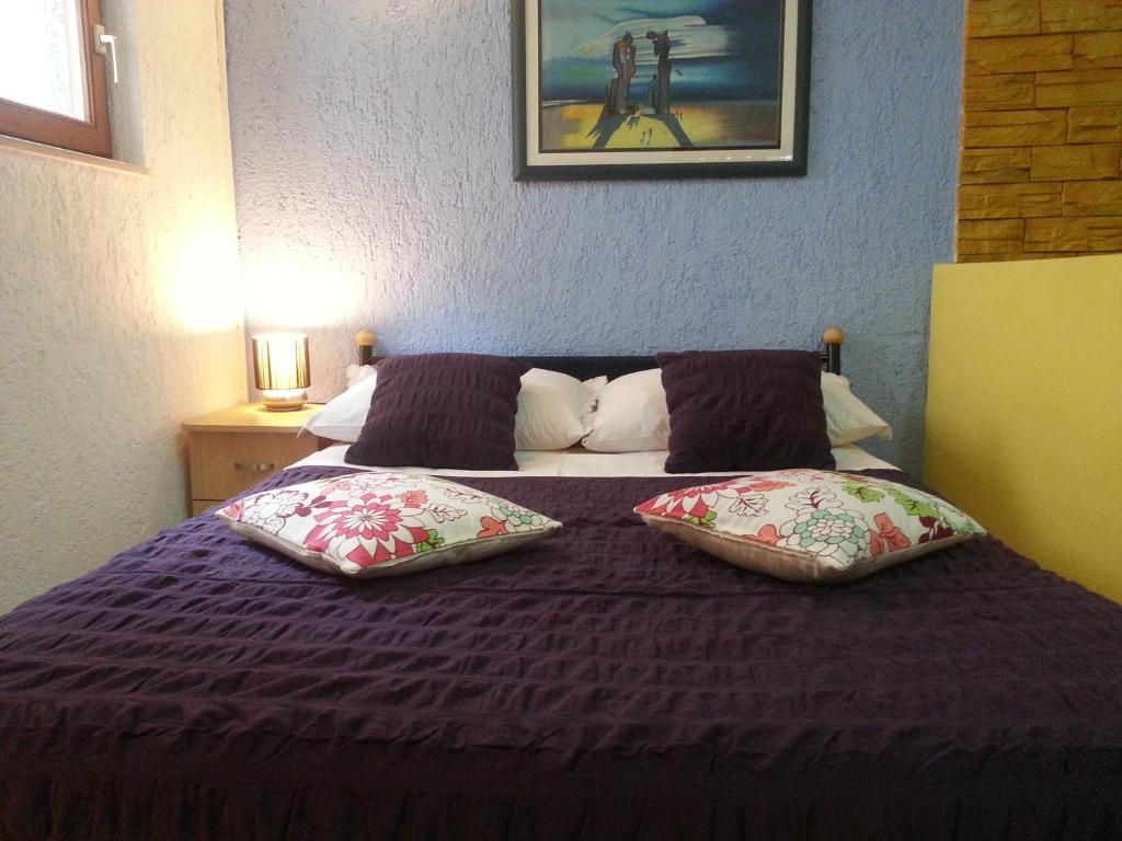 Łóżko lub łóżka w pokoju w obiekcie Apartments Sunny Split