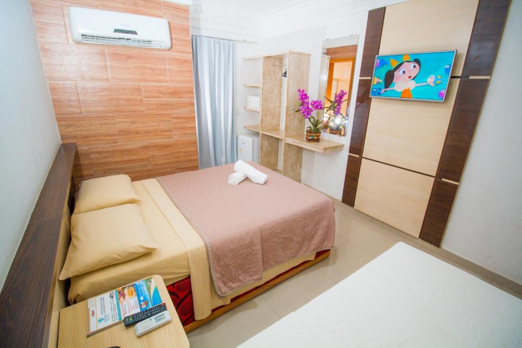 Postel nebo postele na pokoji v ubytování Shangrilá - Rede Soberano
