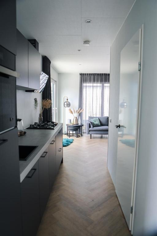 Kuchyň nebo kuchyňský kout v ubytování Beachhouse Renesse 2645