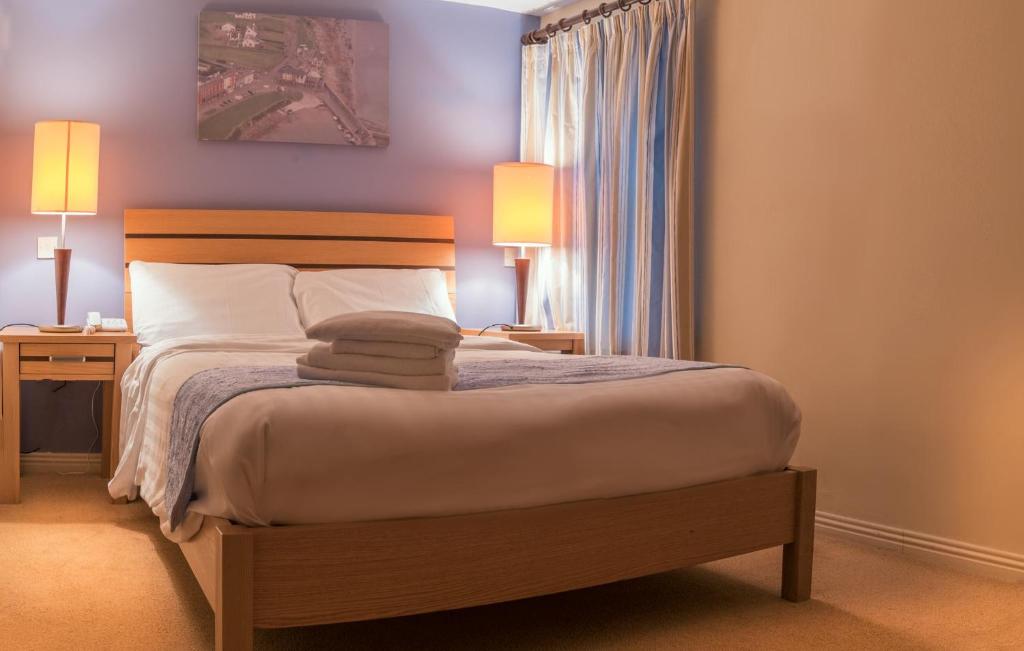 Postel nebo postele na pokoji v ubytování Pier Head Hotel Spa & Leisure