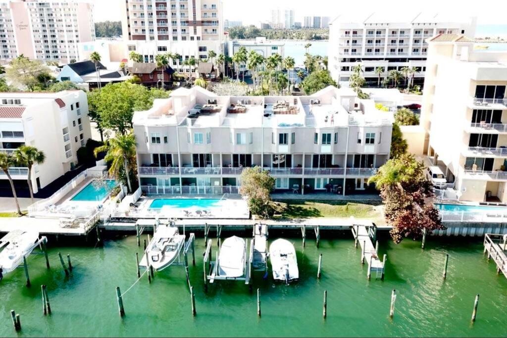 a large building with a marina with boats in the water at Luxury and Spacious Waterside Getaway in Clearwater Beach