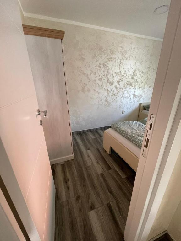 Postel nebo postele na pokoji v ubytování Apartman 67