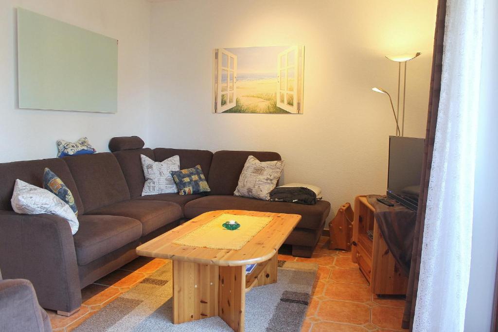 a living room with a couch and a coffee table at Ferienwohnung Baumert in Grömitz