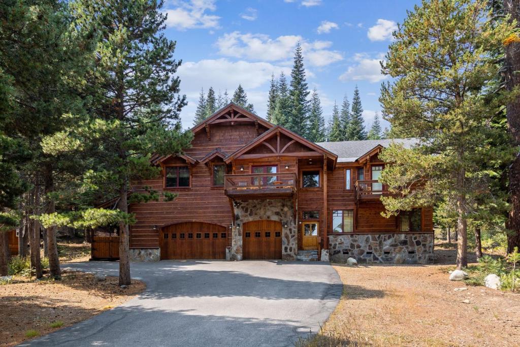 a large wooden house with a driveway at Bear Meadows Lodge - Hot Tub - Tahoe Donner Home in Truckee