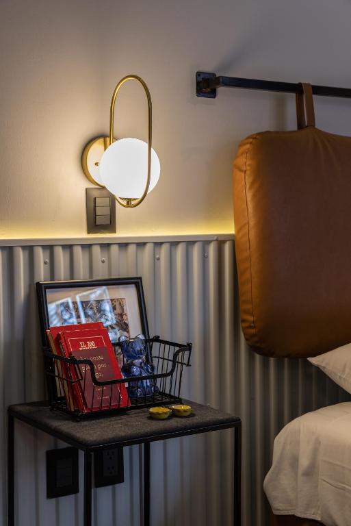 Postel nebo postele na pokoji v ubytování Casa Nada Hotel