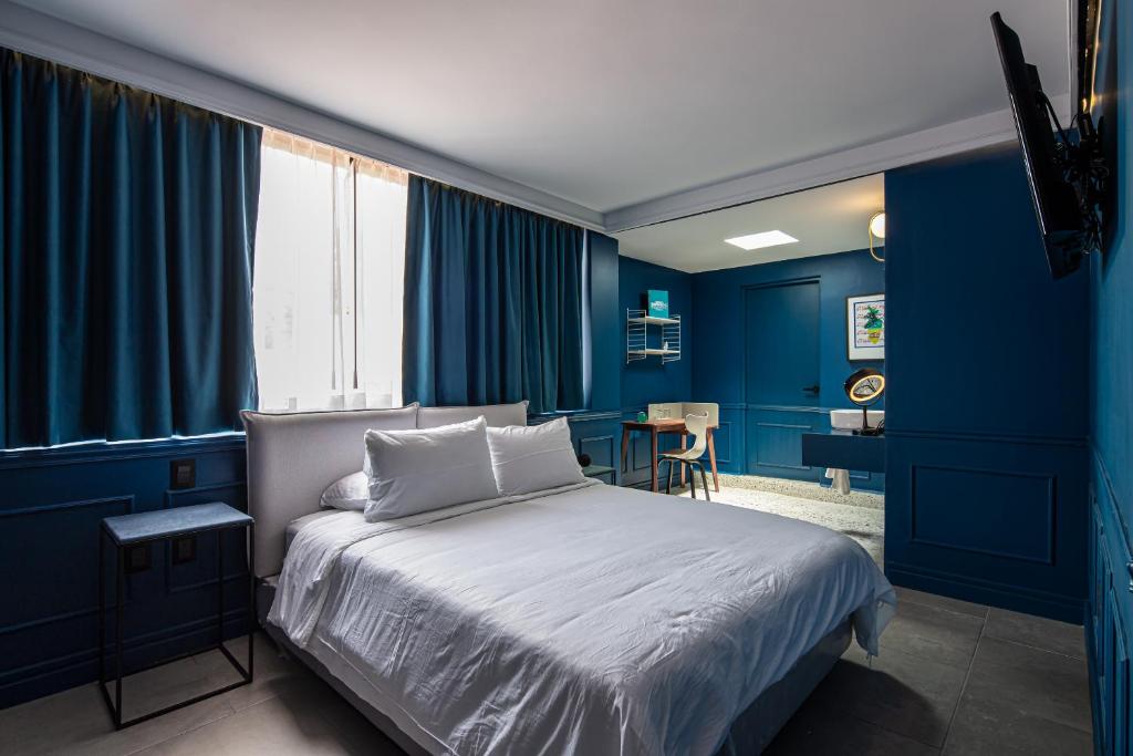 Postel nebo postele na pokoji v ubytování Casa Nada Hotel