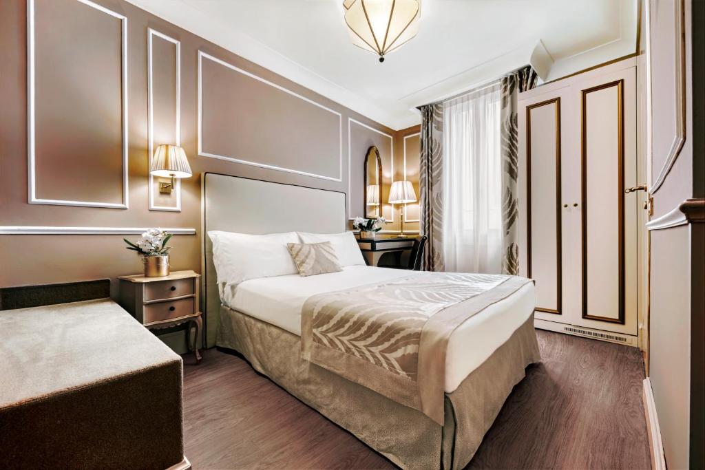 Postel nebo postele na pokoji v ubytování Hotel Nuovo Teson
