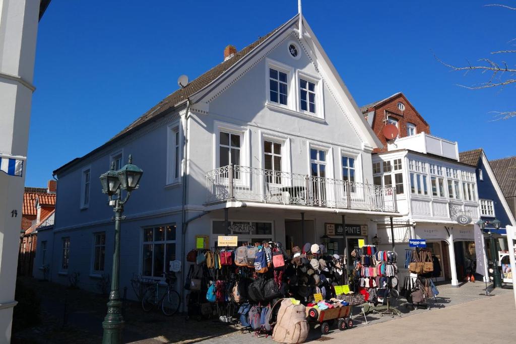 a building with a lot of clothes on display outside at Haus Hansen - Wyk Whg 01 in Wyk auf Föhr