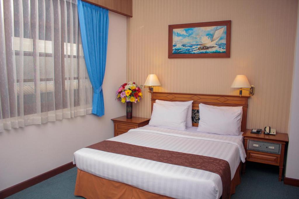 Postel nebo postele na pokoji v ubytování Sapta Nawa Resort 1 Gresik