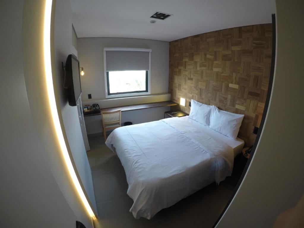 Postel nebo postele na pokoji v ubytování LA HOTEL VOTUPORANGA