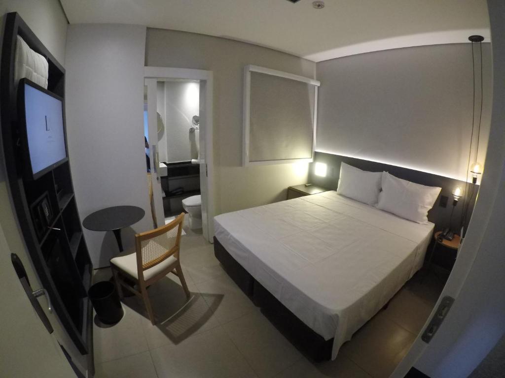 Postel nebo postele na pokoji v ubytování LA HOTEL VOTUPORANGA