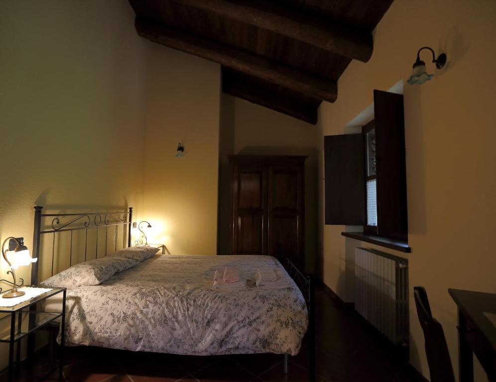 Postel nebo postele na pokoji v ubytování Agriturismo A Nostro Mizoun