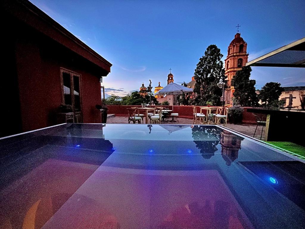 a swimming pool in the middle of a building at Hotel Casa Oratorio "Adults Only" in San Miguel de Allende