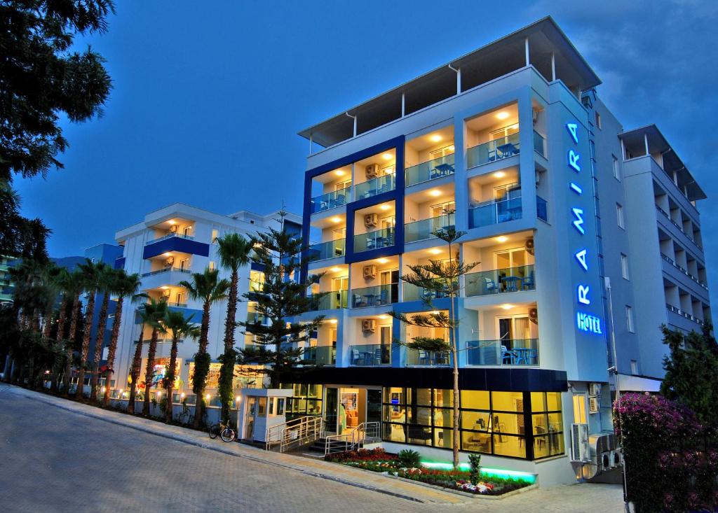 a large white building with trees in front of it at Kleopatra Ramira Hotel - All Inclusive in Alanya