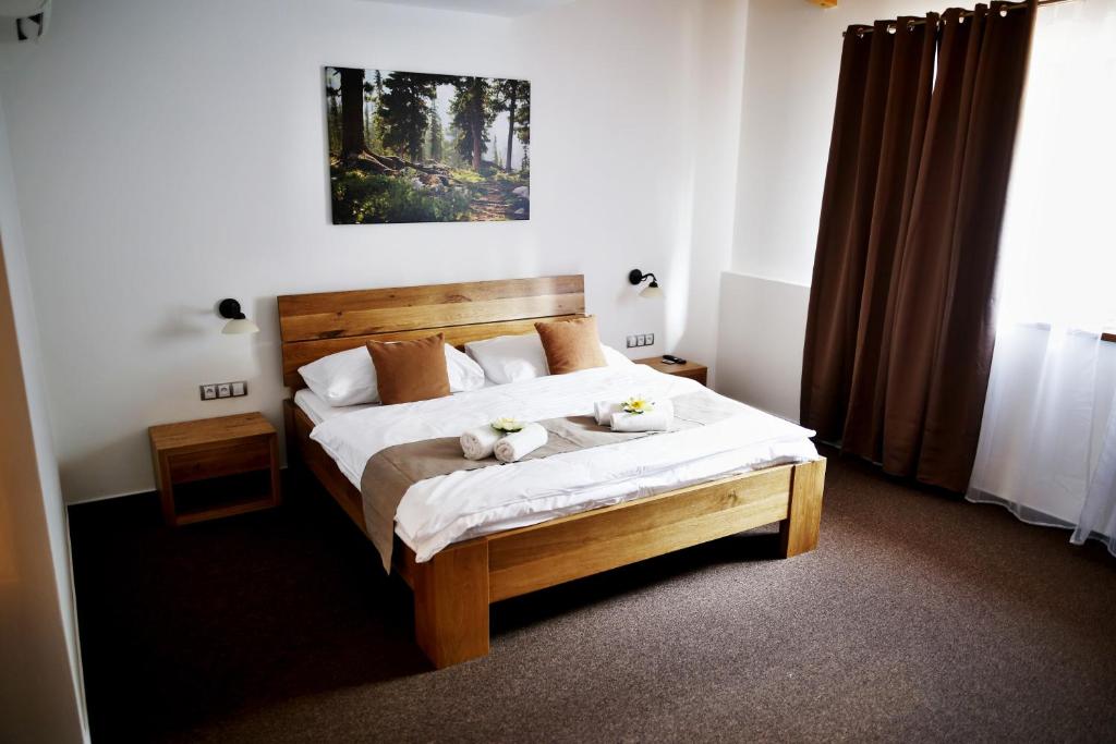 Postel nebo postele na pokoji v ubytování Hotel Farma Vysoká