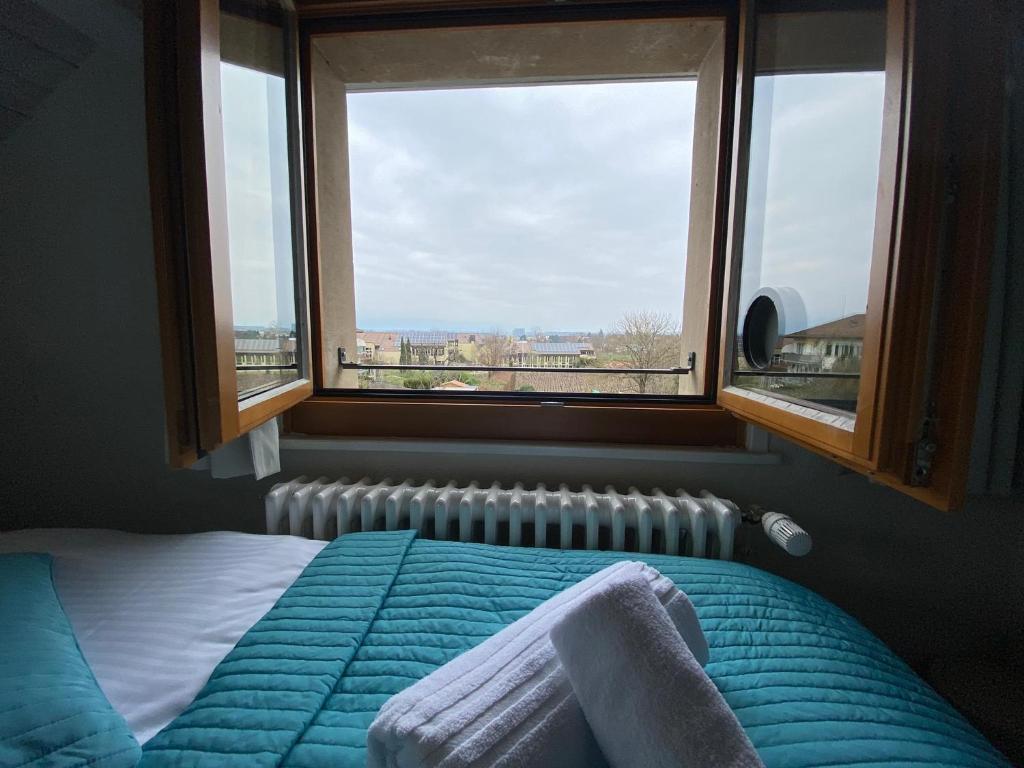 Postel nebo postele na pokoji v ubytování Auberge de Confignon