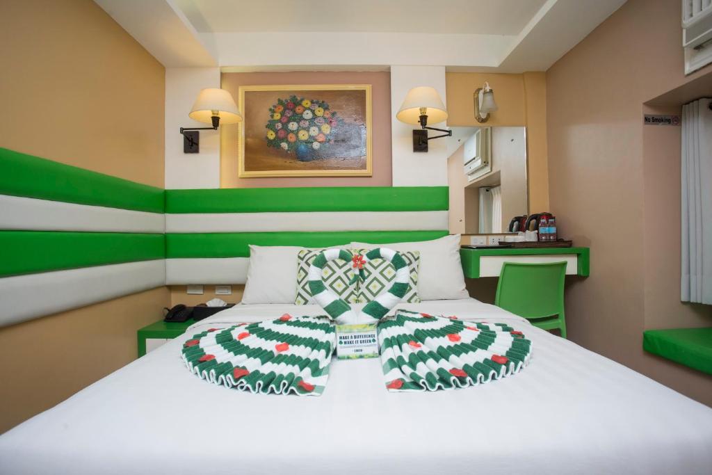 Postel nebo postele na pokoji v ubytování Red Coco Inn de Boracay