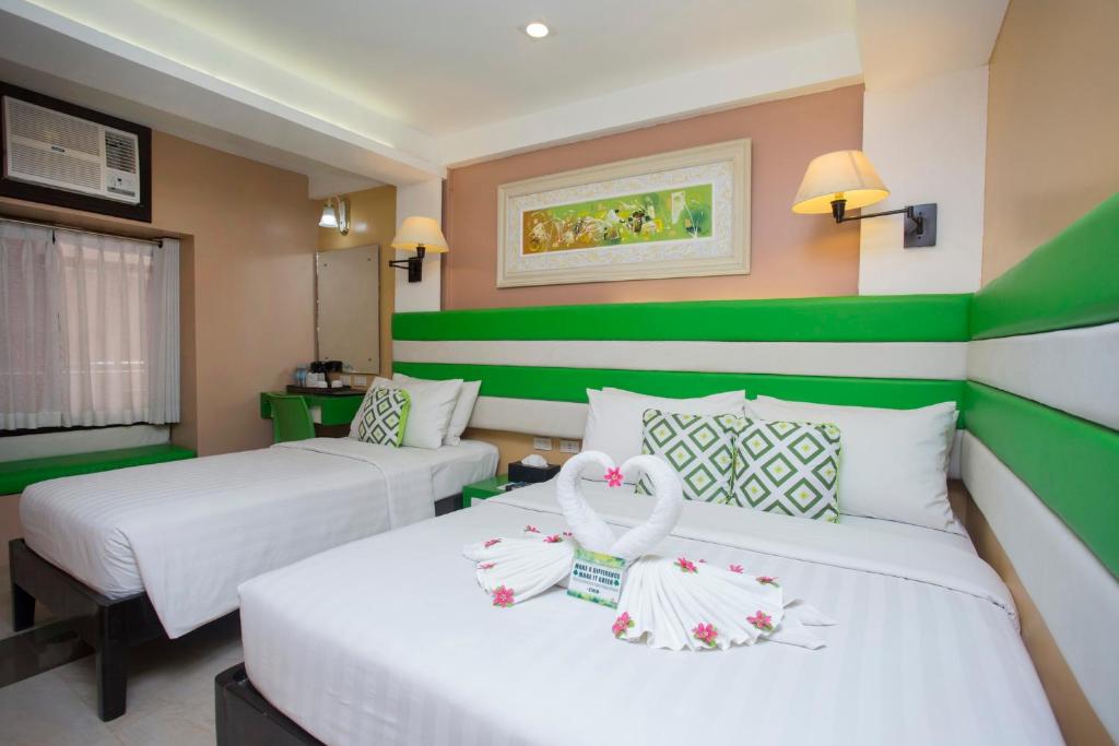 Postel nebo postele na pokoji v ubytování Red Coco Inn de Boracay