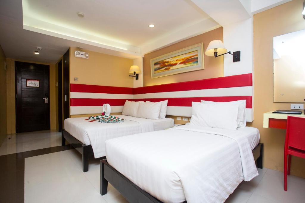 Postel nebo postele na pokoji v ubytování Red Coco Inn de Boracay