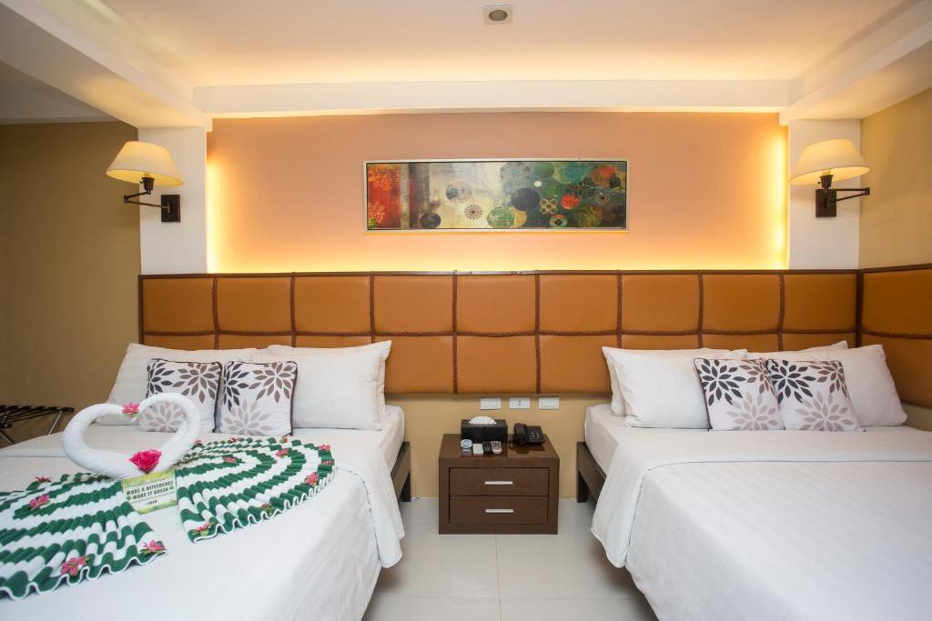 Postel nebo postele na pokoji v ubytování Red Coco Inn de Boracay