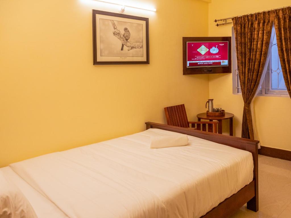 TV a/nebo společenská místnost v ubytování Aakash Rooms and Cottages,
