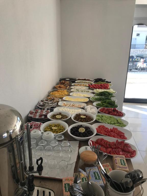 a long buffet of food on a table at Demyra Boutique Hotel in Demre