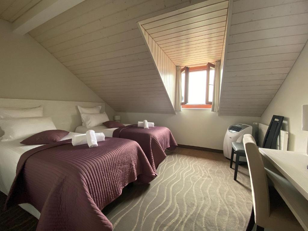 Postel nebo postele na pokoji v ubytování Auberge de Confignon