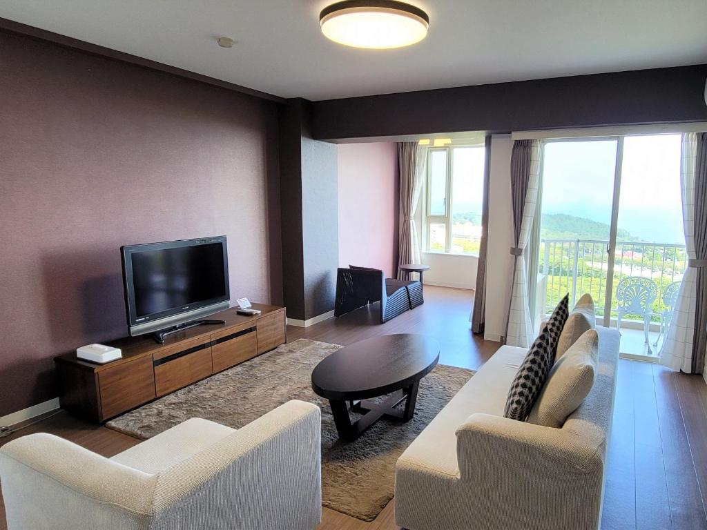 TV a/nebo společenská místnost v ubytování Hotel Village Izukogen