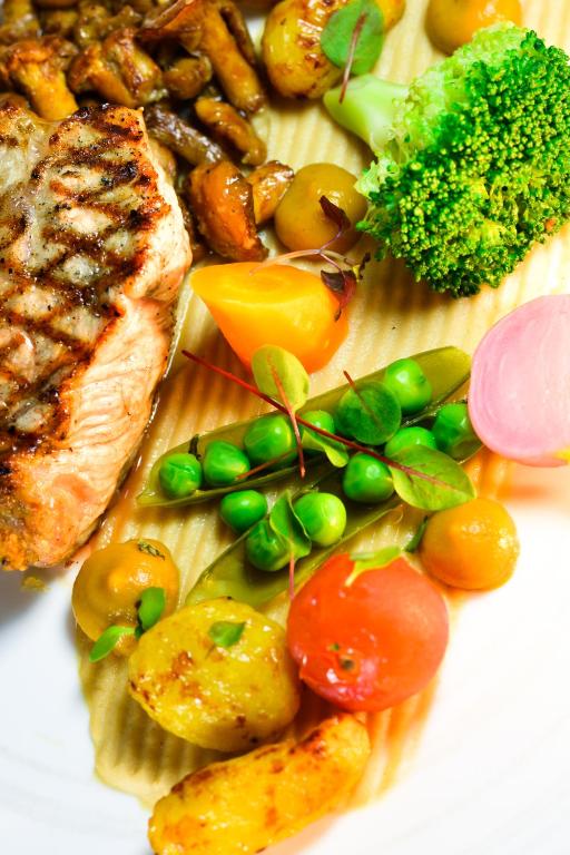 a plate of food with meat potatoes and vegetables at Hotel Restaurant Le Maréchal - Teritoria in Colmar