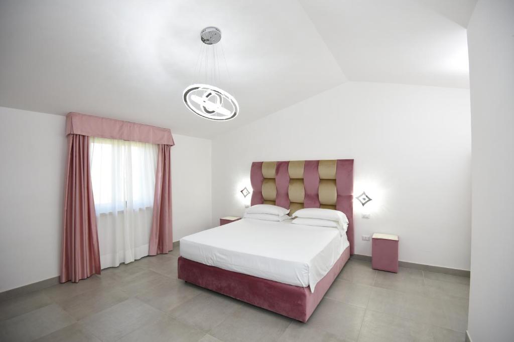 Postel nebo postele na pokoji v ubytování Agriturismo Borgo Imperiale