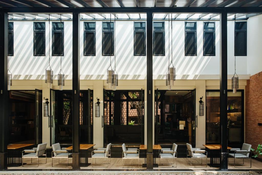 A bright open-air seating area framed by glass and brick architecture.