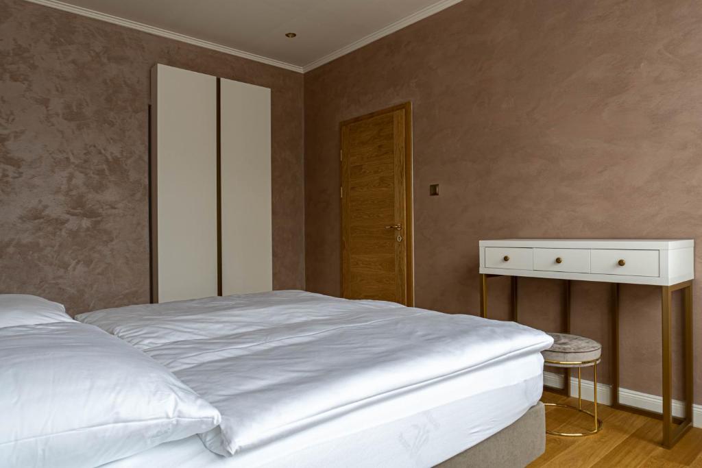Postel nebo postele na pokoji v ubytování Rosso Aparthotel