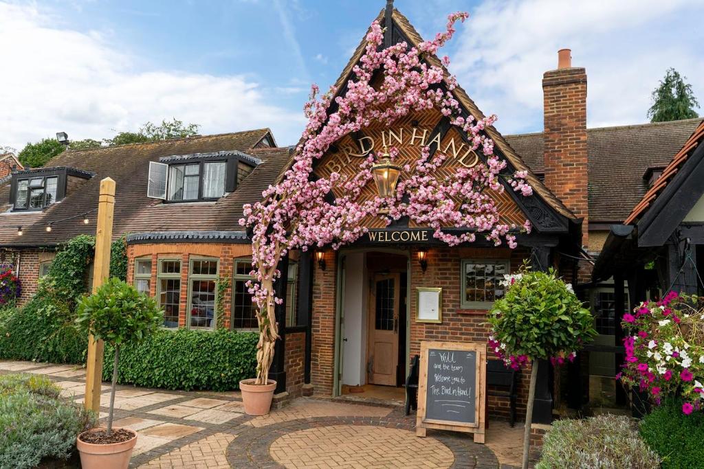 a building with a bunch of flowers on it at The Bird In Hand in Maidenhead