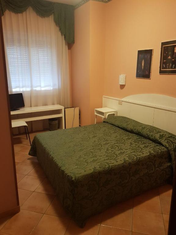 Postel nebo postele na pokoji v ubytování Hotel Monna Lisa