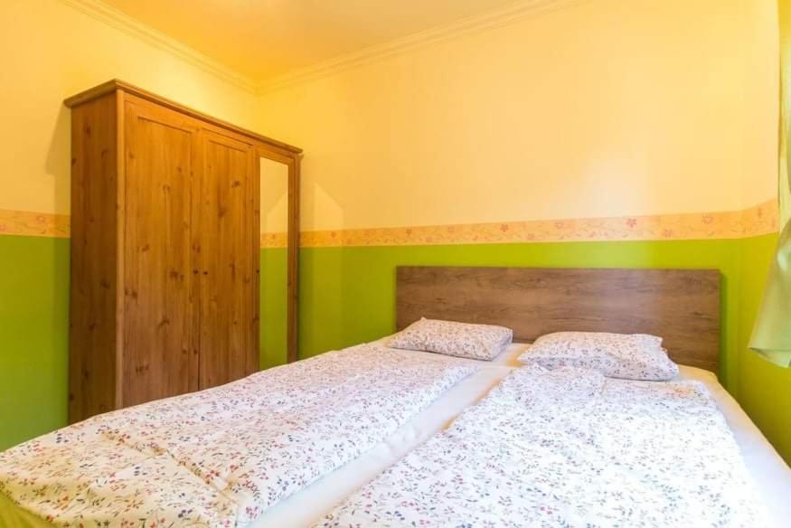 Ein Bett oder Betten in einem Zimmer der Unterkunft Zalán apartmann